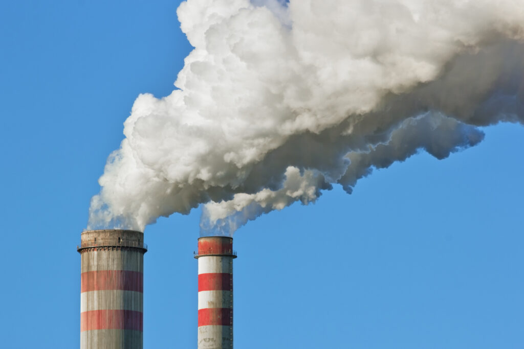 Smoke stack showing large amount of smoke coming out of it
